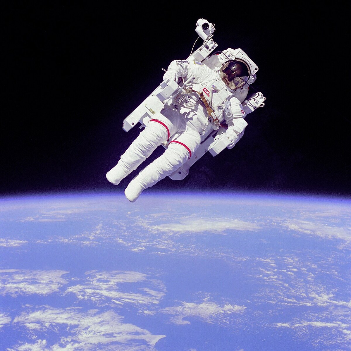 Bruce McCandless on his 1984 untethered spacewalk — original NASA photo with the black of space behind him